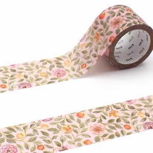 May include: A roll of decorative washi tape with a floral pattern. The tape has a light pink background with a design of pink flowers, orange fruits, and green leaves. The tape is unrolled, displaying the repeating pattern.