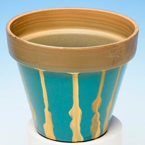 Abstract 'drip' design on blue bamboo flower pot