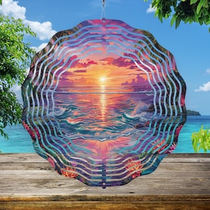 May include: A metal wind spinner with a colorful sunset over the ocean scene. The spinner has multiple layers of metal that create a swirling effect when it spins in the wind.