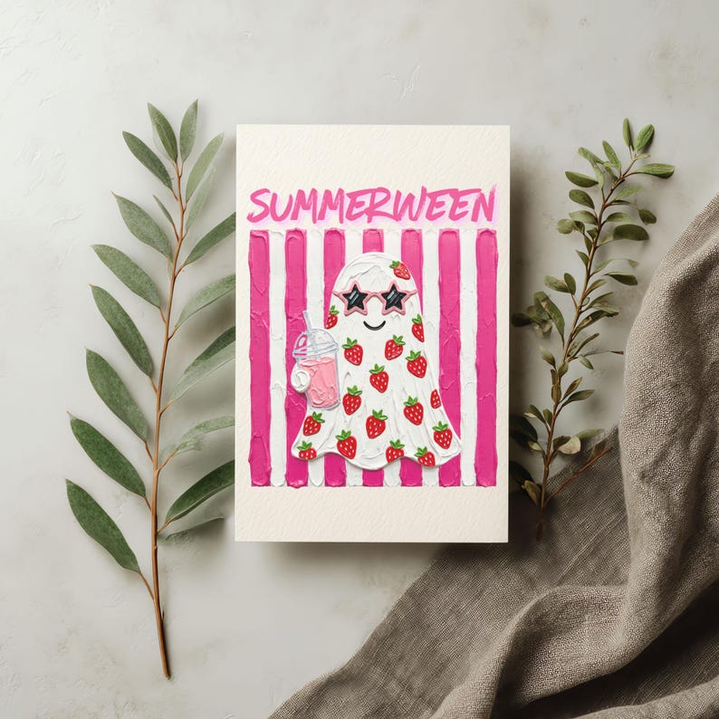 May include: A greeting card with a ghost illustration. The ghost is white with red strawberries and star-shaped sunglasses, holding a pink drink. The background has pink and white stripes, and the word "SUMMERWEEN" is written at the top.