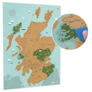 May include: A brown and tan scratch-off map of Scotland with green areas highlighting national parks. The map is surrounded by a light blue border and includes a compass and the text "Uncover the Magic".