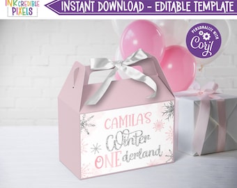 May include: Pink and white favor box with a silver glitter design. The box has a handle and says "Camila's Winter Wonderland".