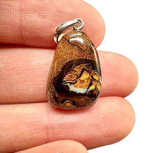 Silver pendant from Australian boulder opal