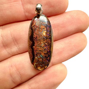 Silver pendant from Australian boulder opal