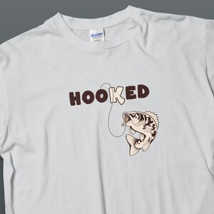 Funny Fishing T-Shirt with Bass Graphic, HOOKED Quote for Anglers, Casual Fishermen Apparel, Unique Gift for Dad, Soft Cotton Tee