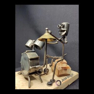 Rhythmic Beats: Recycled Metal Drummer Sculpture