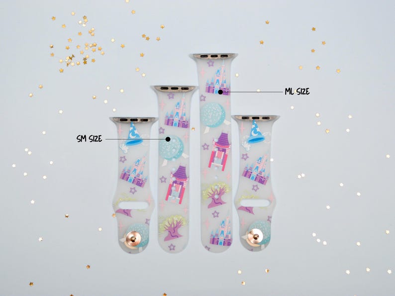 May include: Three white silicone Apple Watch bands with a colorful Disney castle and character print. The bands are labeled "SM Size", "ML Size", and "LG Size".