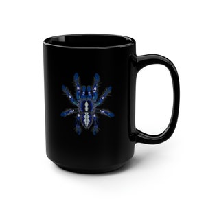 May include: Black ceramic coffee mug with a blue and white tarantula spider graphic.