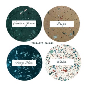 May include: Four different terrazzo colors: hunter green, beige, navy blue, and white. Each color is shown in a circle with a white label with the color name.