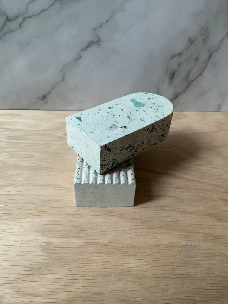 This arch bookend is perfect for adding style to any mantel, dresser, or desk or for using as book ends. Concrete cement feel. Each terrazzo piece is unique. Made of gypsum cement