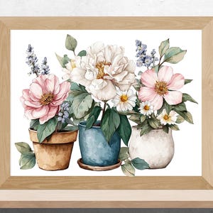 May include: Watercolor painting of flowers in pots, framed in a light wood. The artwork features pink, white, and blue flowers with green leaves. The pots are in shades of brown, blue, and white.