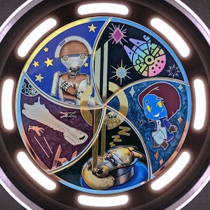 May include: A circular, multi-colored pin with a gold rim. The pin features four sections, each with a different image. The top section shows a blue background with stars and a robot. The right section shows a blue background with a blue character. The bottom section shows a blue background with a brown character. The left section shows a pink, blue, and yellow background with a spaceship.