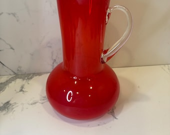 Vintage MCM Blenko red pitcher with applied handle.