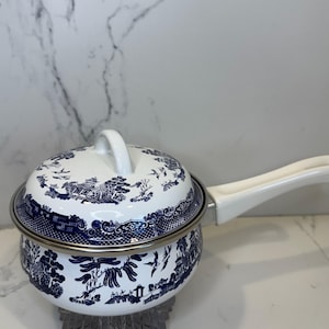 Vintage enamel rare hard to find 1 QT BLUE WILLOW blue and white saucepan and lid with non-stick coating inside pan.