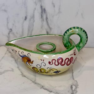 Beautiful vintage hand-painted Italian Deruta ceramic finger candleholder. Sought after by collectors for its artistry and dragon designs.