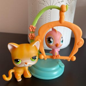 Authentic 2004 Hasbro  Littlest Petshop Orange Cat and Pink Bird on Swing set