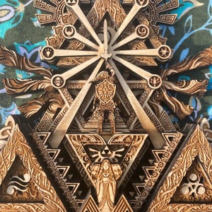May include: A multi-layered wooden artwork with a detailed design of geometric shapes and figures. The piece features a central figure with a sword, surrounded by intricate patterns and symbols, in shades of brown and beige.