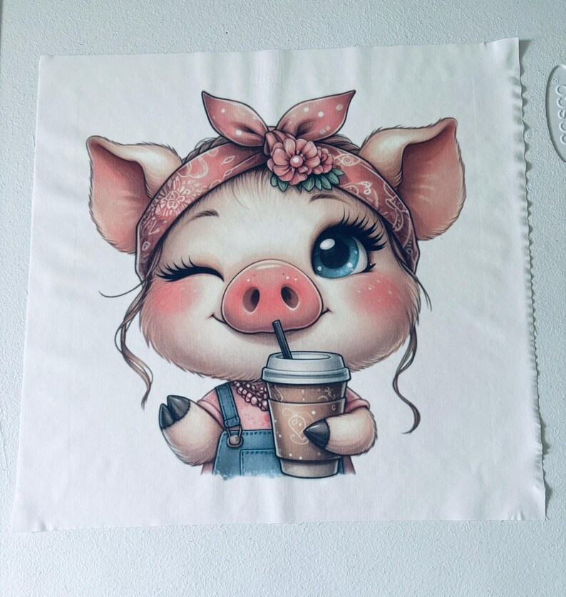 May include: A cartoon pig wearing a pink bandana with white polka dots and a pink flower, holding a brown paper cup with a straw. The pig is winking and has blue eyes.