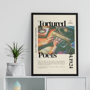 May include: A black framed poster with the text "Tortured Poets" in white and black lettering. The poster features a vintage typewriter with hands typing on it. The text "All's fair in love and poetry" is on the left side of the poster and "04.1924" is on the right side of the poster.