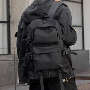 Bolso de mano Mochila con función de tendencia Mochila masculina Bolsa de viaje de gran capacidad Mochila para estudiantes de secundaria Marca de moda Bolsa masculina informal