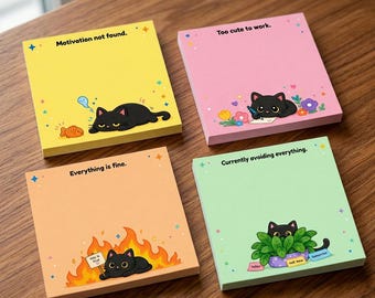 May include: Four square sticky note pads in yellow, pink, orange, and light green. Each pad features a black cat illustration and text: Motivation not found, Too cute to work, Everything is fine, and Currently avoiding everything with small stars.
