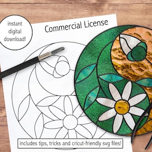 May include: A stained glass design with green, gold, and white colors, featuring a daisy and a flower bud. A black and silver craft knife and pliers are next to the design. The words "instant digital download!" and "Commercial License" are visible.