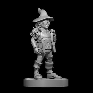 May include: A gray, 3D printed miniature of a gnome wearing a pointed hat, goggles, and armor with gears and cogs. The gnome is holding a book and has a backpack with a spider on it.