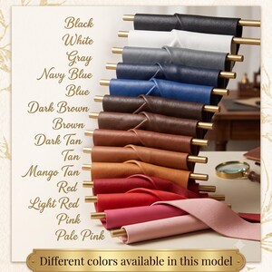 A stacked display of various leather color swatches with text listing color names from black to pale pink.
