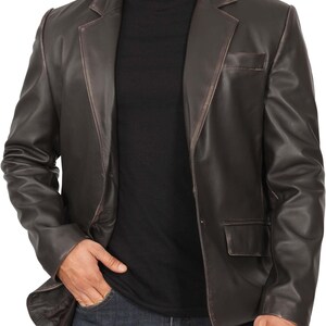 May include: A brown leather blazer with a single-breasted closure and two front pockets.