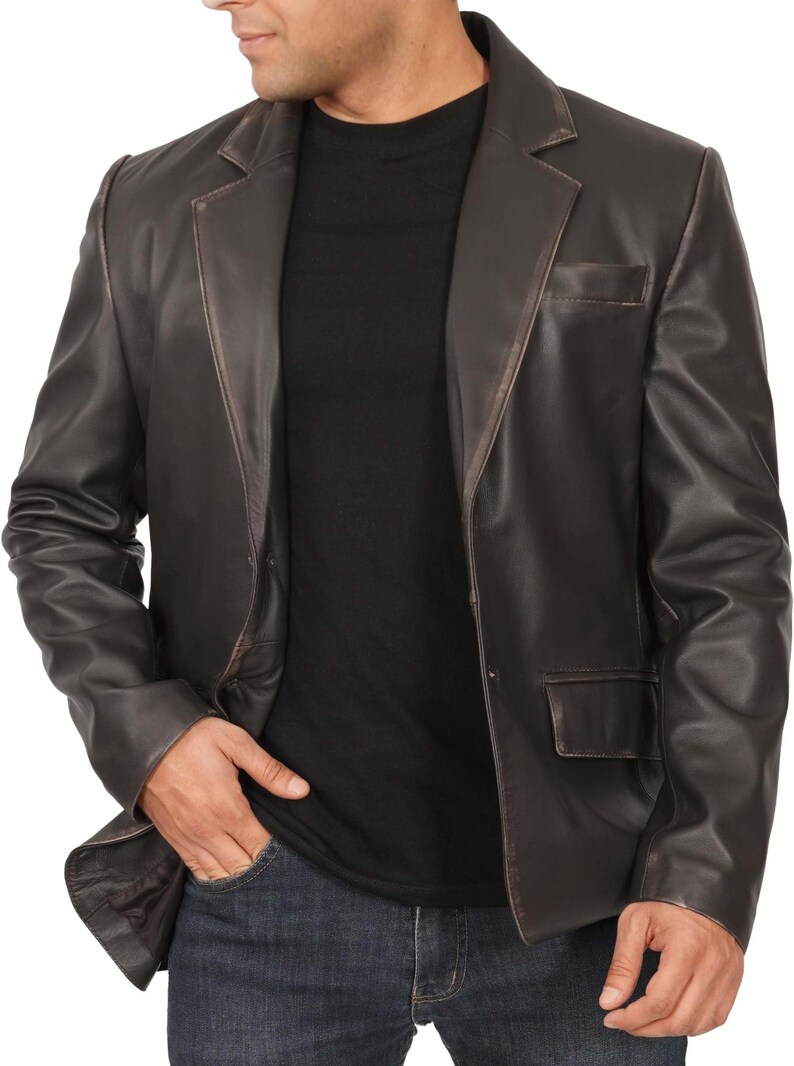 May include: A brown leather blazer with a single-breasted closure and two front pockets.