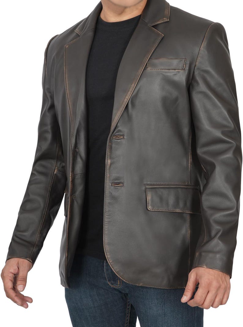 May include: A brown leather blazer with a distressed look. The blazer has a two-button closure and a single chest pocket.