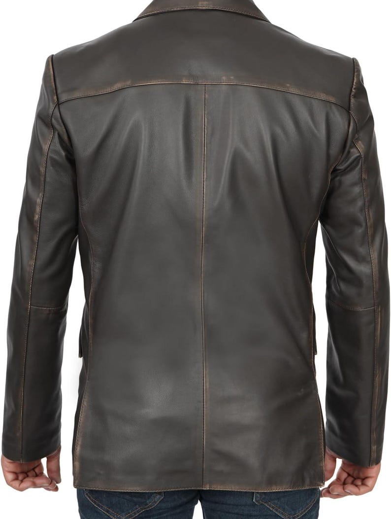 May include: A brown leather blazer with a distressed look. The blazer has a single-breasted closure and two front pockets.
