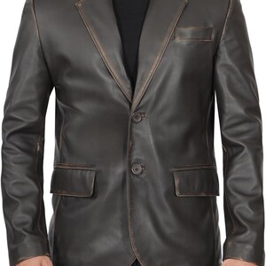 May include: A brown leather blazer with a two-button closure and a single pocket on the left side.