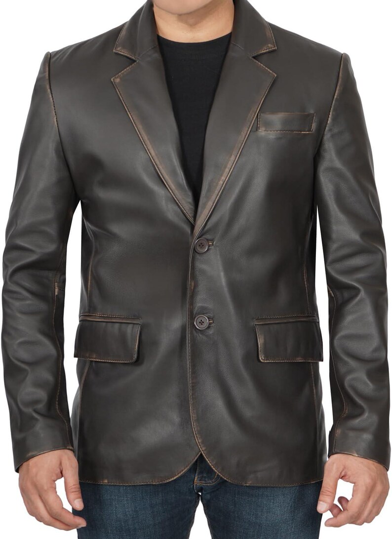 May include: A brown leather blazer with a two-button closure and a single pocket on the left side.