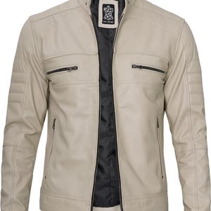 May include: A beige leather jacket with a zipper closure and multiple pockets. The jacket has a stand-up collar and a black lining.
