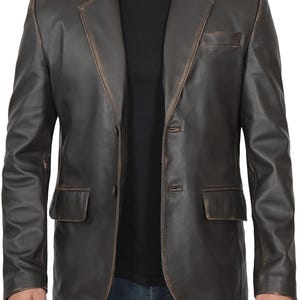May include: A brown leather blazer with a distressed look. The blazer has a notched collar, two button closure, and two front pockets.