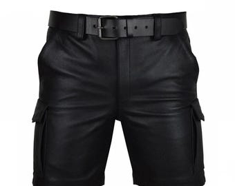 May include: Black leather shorts with a matching belt. The shorts have two cargo pockets on the sides and a classic belt buckle. The leather appears smooth and the shorts are designed for a comfortable fit.