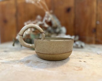 Ceramic cup with whitish glaze