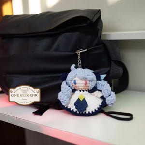 ✂️🧵 Bring the magic of threads and scissors to life with this Gwen-inspired crochet plush, a handmade tribute to the seamstress champion from League of Legends.

Crafted in two options — a 6-inch doll for your desk or display shelf, and a tiny 3-inch keychain for your bag, keys, or car — this doll features Gwen’s signature blue hair, doll-like eyes, and iconic outfit details. A whimsical and elegant gift for any LoL fan!