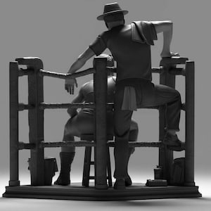 May include: A monochrome sculpture depicting a boxing ring. One figure, wearing a hat and striped trousers, leans on the ropes. Another figure sits on a stool within the ring.