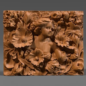 May include: A rectangular wooden relief carving depicting a woman's face amidst detailed floral elements. The carving is in shades of brown, with visible wood grain, and shows large flowers and foliage.