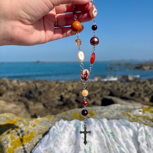 Decade mini rosary with red orange pearl mix beads and silver crucifix and Jesus Christ The Good Shepherd medal pendant