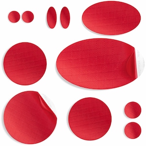 May include: A set of nine red round and oval stickers with a textured surface. The stickers are various sizes and shapes.