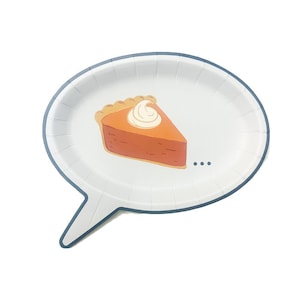 May include: A white paper speech bubble shaped plate with a blue rim. The plate has a cartoon image of a slice of pumpkin pie with whipped cream on top. The text "..." is printed on the plate.