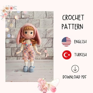 May include: Crochet pattern for a doll with pink bunny ears, overalls, and a pink hat. The pattern is available in English and Turkish. Download the PDF pattern.