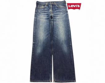 Jeansy Levis 507 Retro z lat 90. w kolorze niebieskim, z szerokimi nogawkami i wyblakłymi wąsami