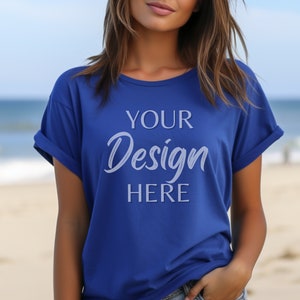 May include: A royal blue t-shirt with the text "YOUR Design HERE" printed on the front.