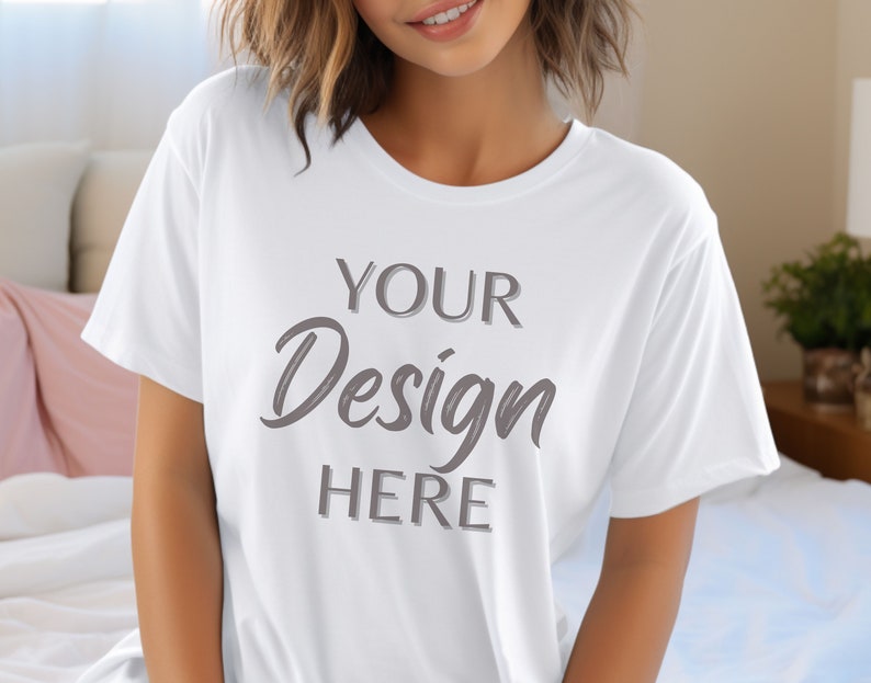 May include: White t-shirt with the text "YOUR Design HERE" printed in grey on the front.
