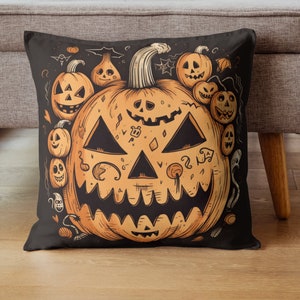May include: Black square throw pillow with a Halloween-themed design. The pillow features a large orange jack-o'-lantern with a carved face, surrounded by smaller jack-o'-lanterns and other spooky illustrations. The background is black.