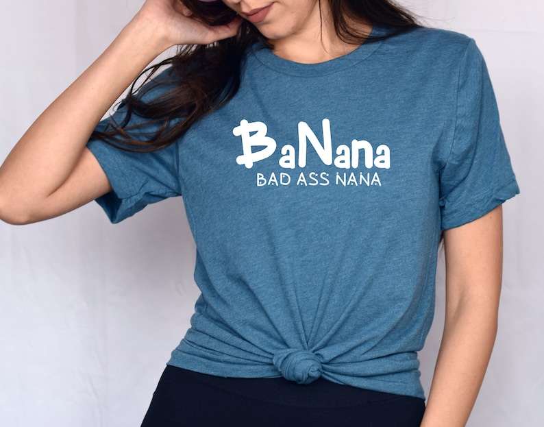 May include: A teal blue t-shirt with the text "BaNana BAD ASS NANA" in white.